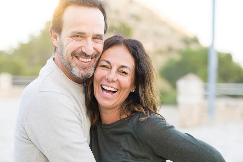 couple having fun getting dental implants